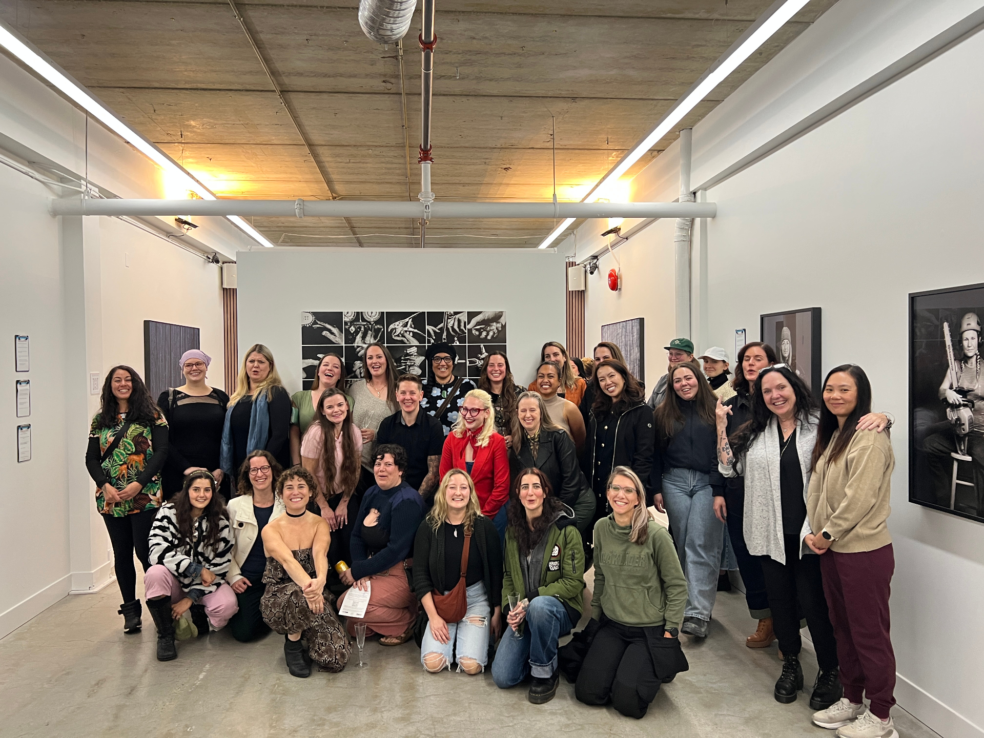 Carly Steiman with the community of tradeswomen at the Tradeswomen Exhibit