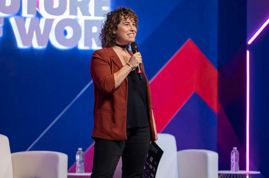 Portrait of Carly Steiman speaking on stage